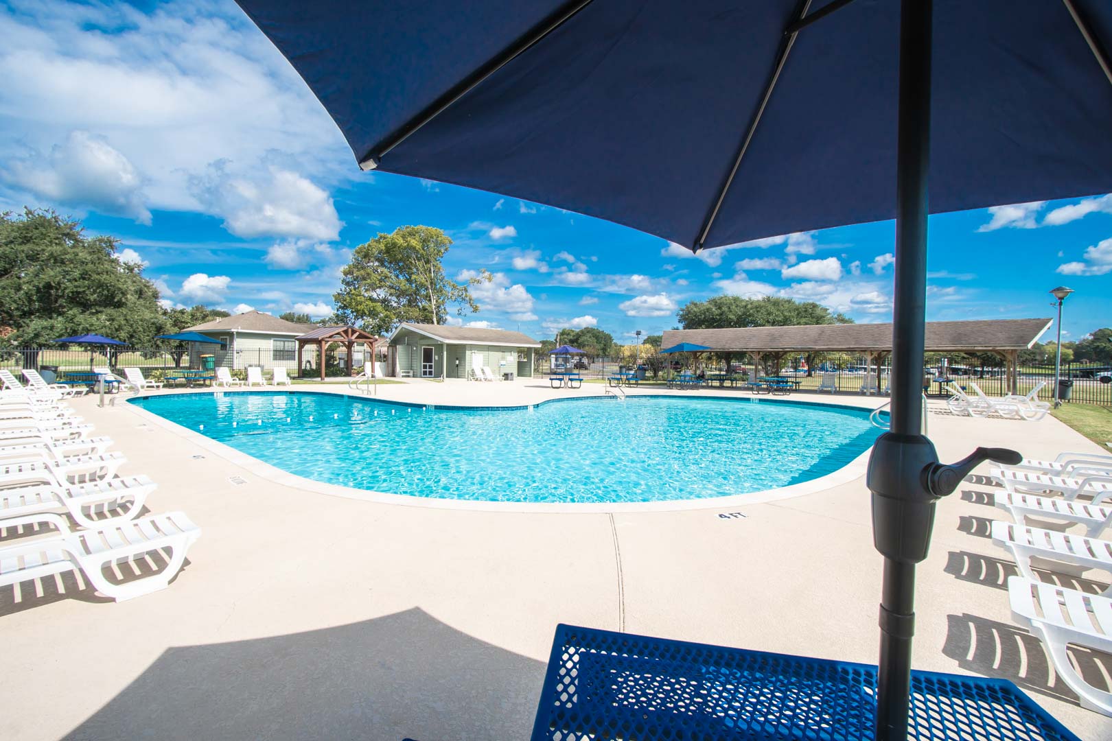 A crisp outdoor swimming pool at VRI's The Landing at Seven Coves in Willis, Texas.